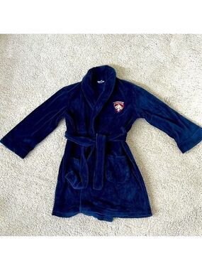 Boys Cherokee navy robe with red and silver crest. Size M